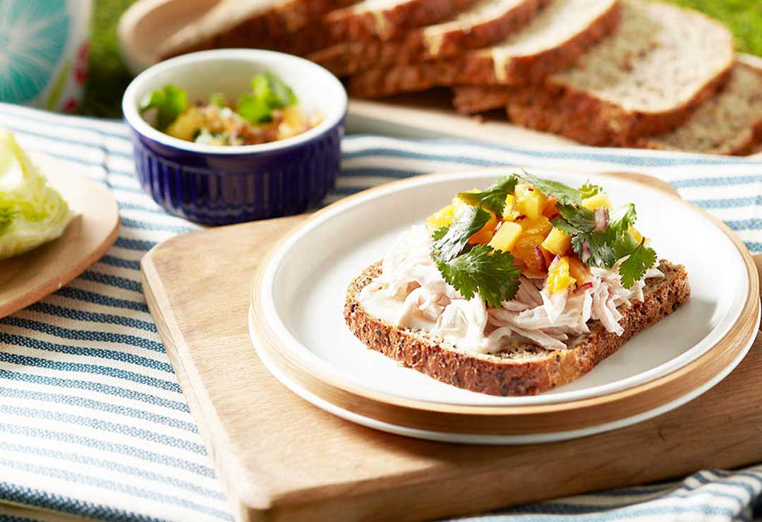 Poached chicken, mango and coriander open sandwich