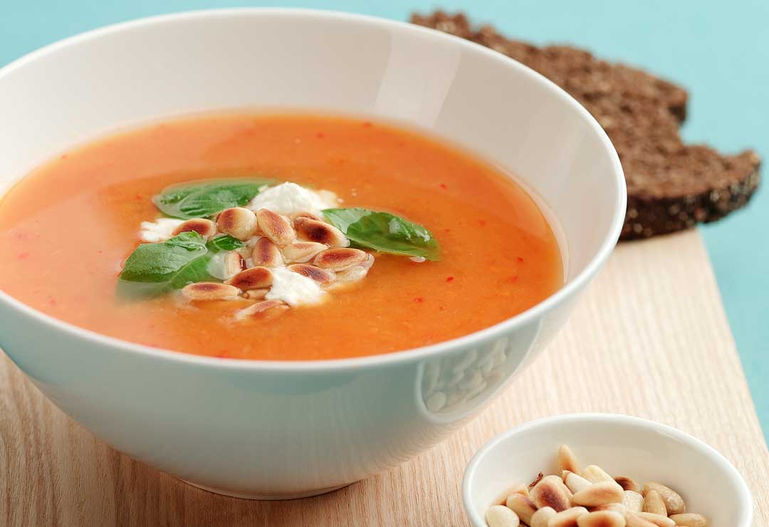 Sweet potato soup with feta and pine nuts